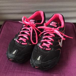 Black and pink Nike Torch 4 shoes